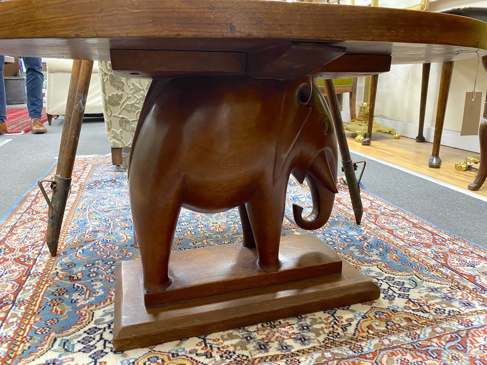 An African oval hardwood elephant occasional table, width 92cm, depth 58cm, height 51cm